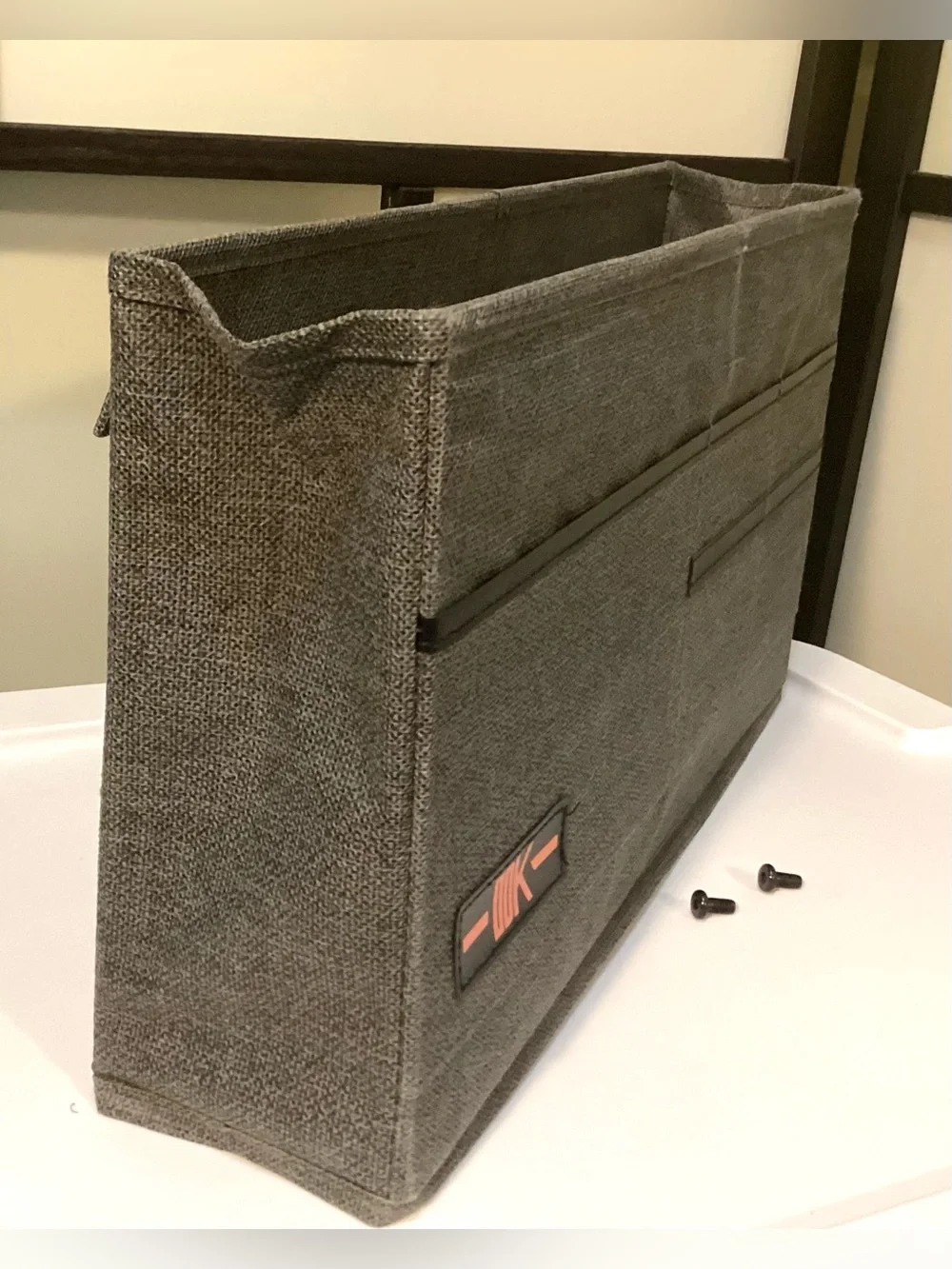 Desk side hanging organizer storage bag with 3 pockets.
